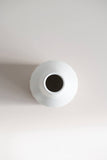 Ceramic peel-carved vase handmade in Canada and finished in a satin white glaze, top view of opening.