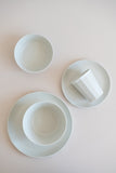 KINTO Japan Alfresco dinner set in beige over view with bowls, plates and a tumbler.