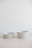 KINTO Alfresco beige soup bowl beside the salad bowl from the side view for size comparison.