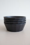 KINTO Alfresco black soup bowls stacked side view.