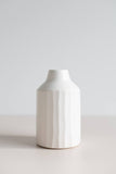 Ceramic peel-carved vase handmade in Canada and finished in a satin white glaze, side view.