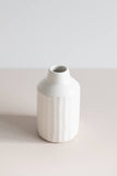 Ceramic peel-carved vase handmade in Canada and finished in a satin white glaze, angled side view.