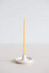 Natural beeswax gala candle in a handmade ceramic candle holder.