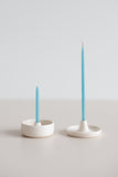 Teal beeswax gala and birthday candles in a ceramic handmade candle holders.